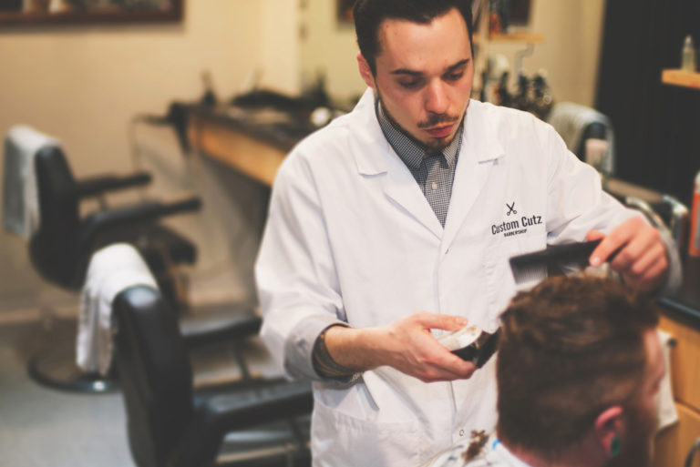 barber giving customer clipper cut